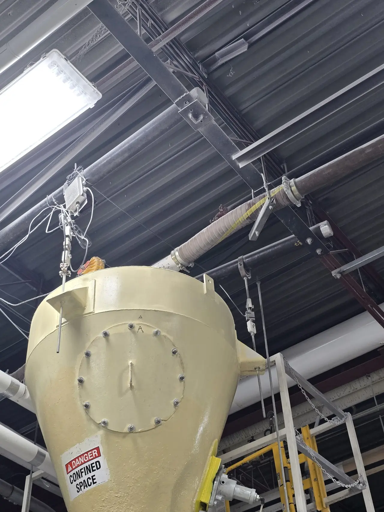 Process hopper suspended from the roof steel inside the plant